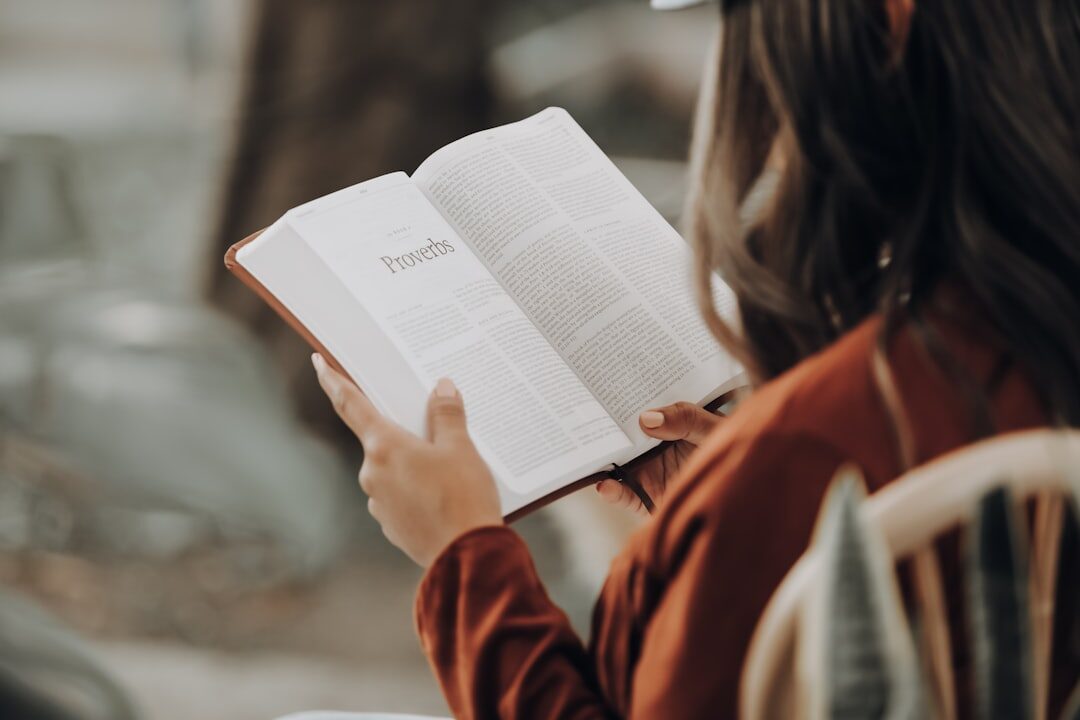 person reading mystery book